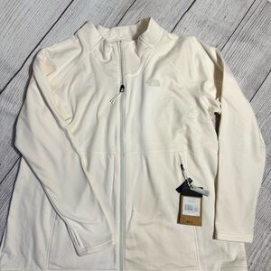 New with tags North Face light weight full zip fleece. Ivory in color.